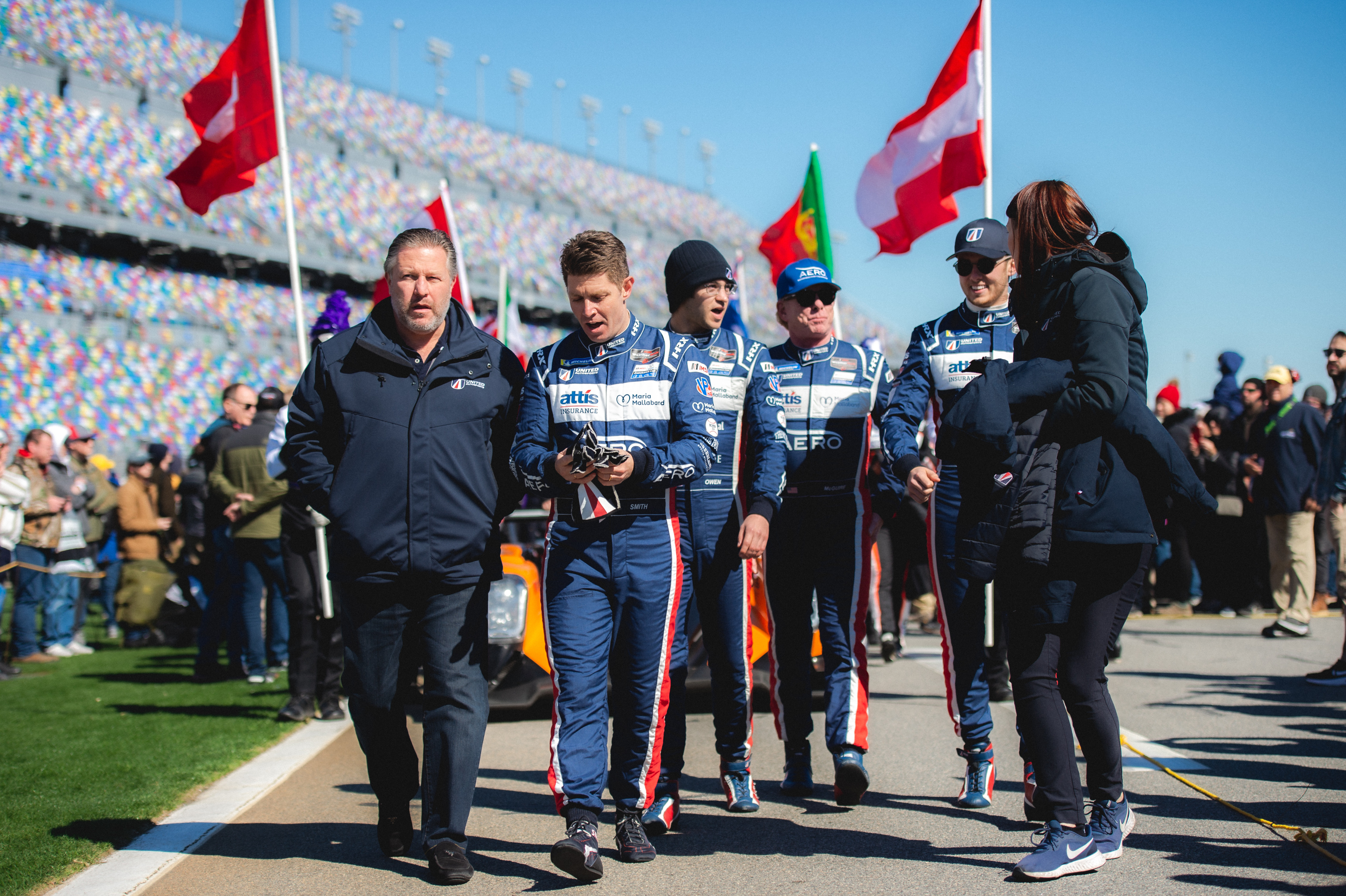 Walking down the pit lane at Daytona with racing drivers and Zak Brown