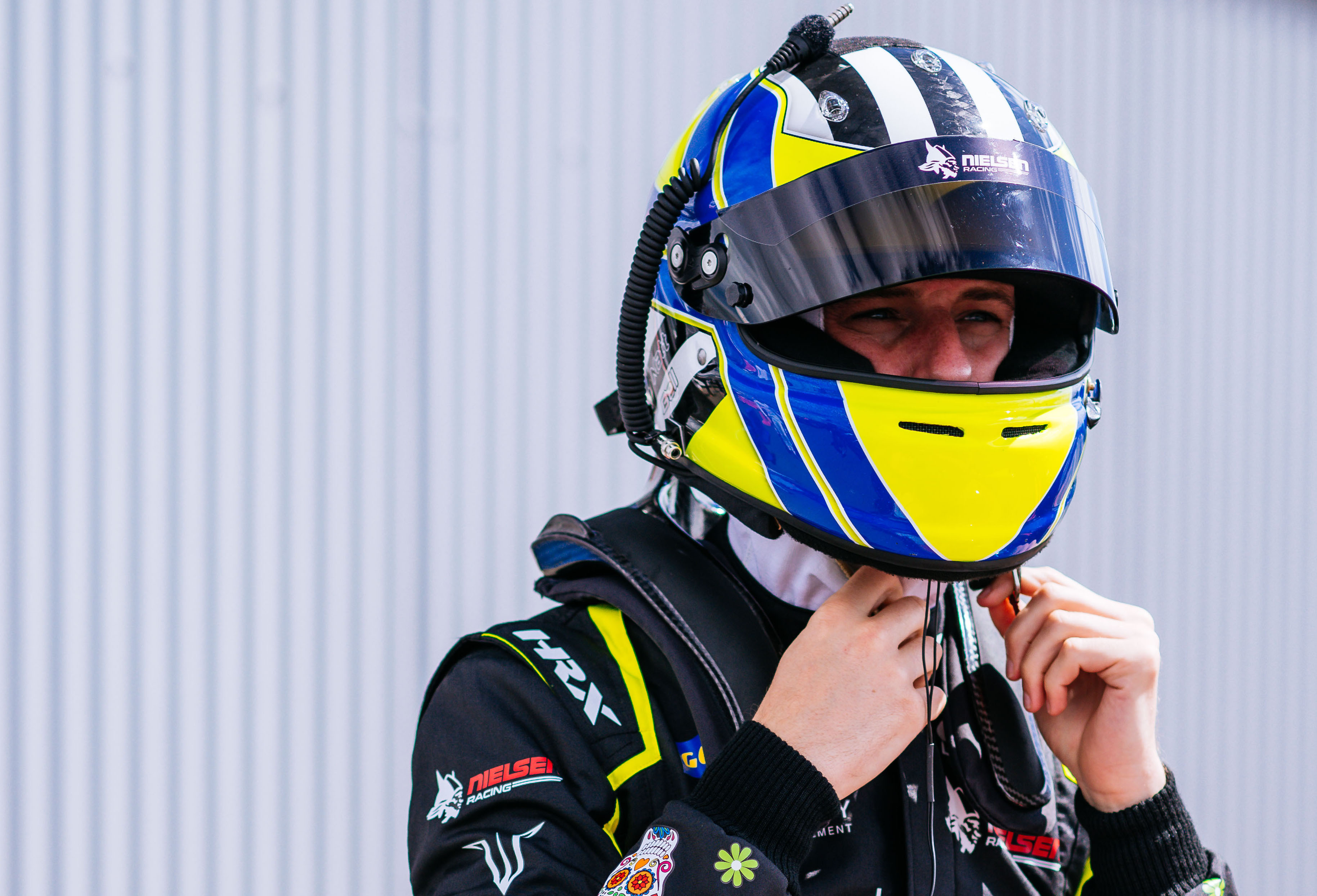 Matt Bell racing driver with helmet on