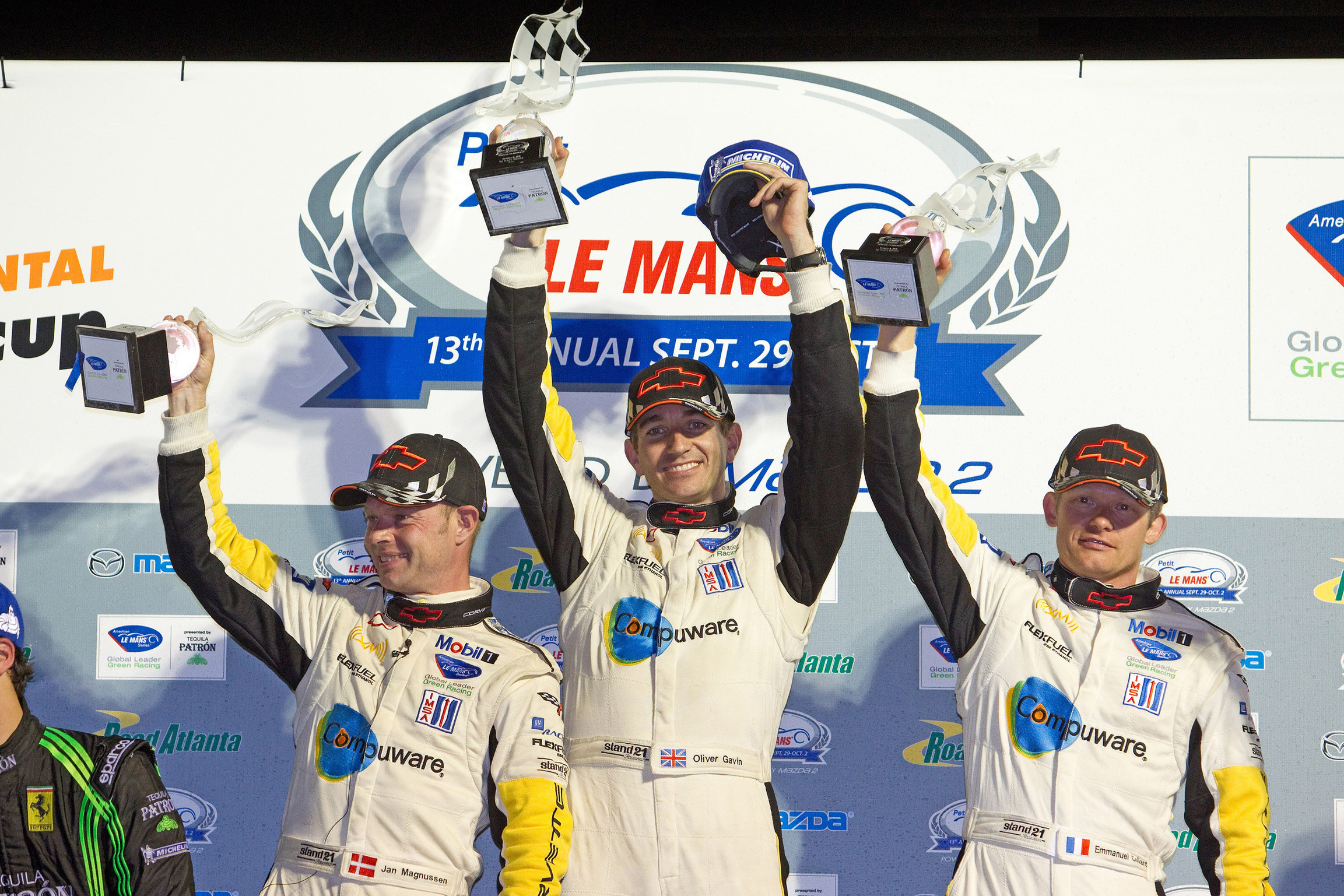 Oliver Gavin and team mates on the podium at Petit Le Mans
