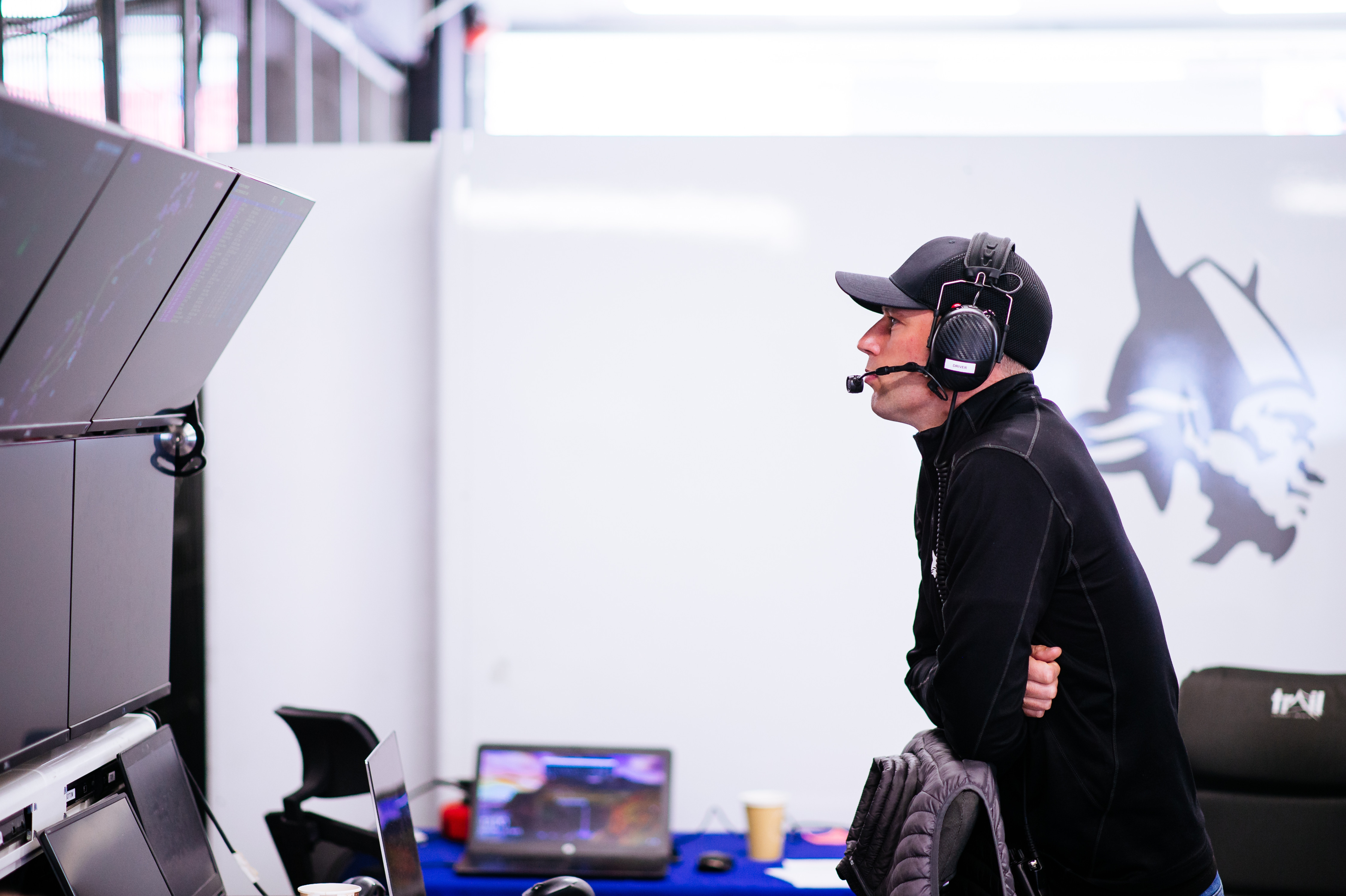 Matt Bell wearing a headset watching the timing screens